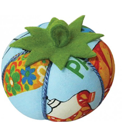 Tomatoes pin holder mannequin on blue background