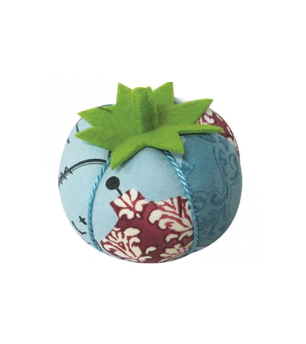 Burgundy mannequin pin tomatoes on blue background