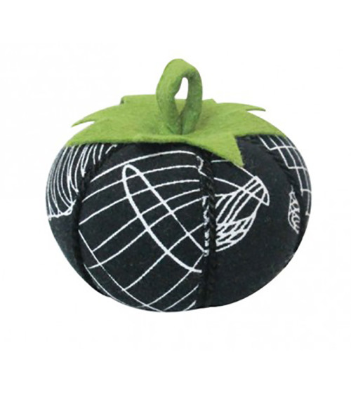 Tomatoes wearing white mannequin pins on black background