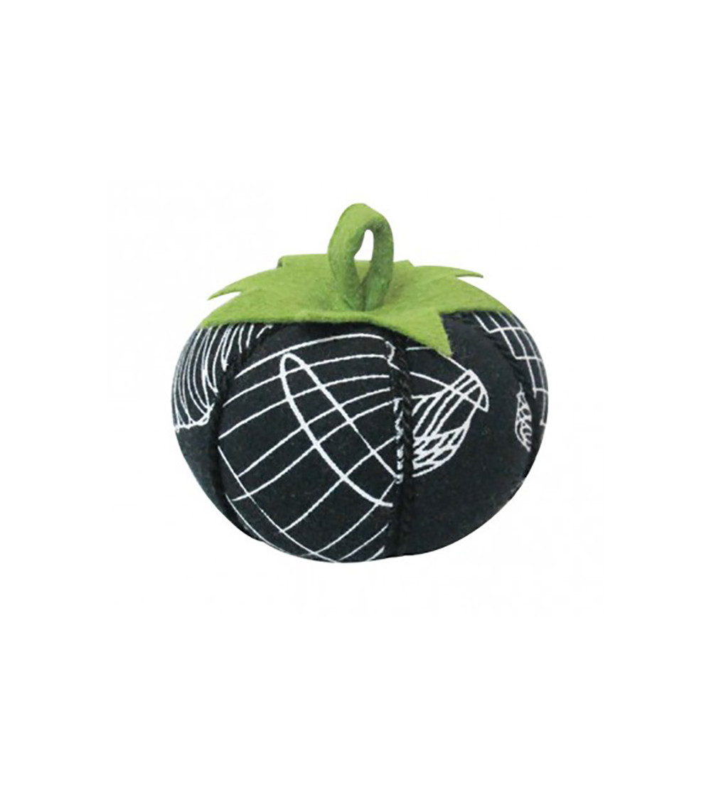 Tomatoes wearing white mannequin pins on black background