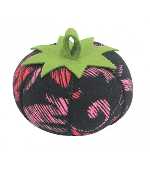 Tomatoes with red and pink arabesque pins on a black background