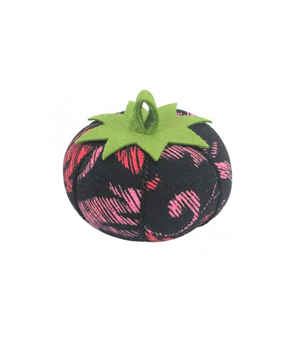 Tomatoes with red and pink arabesque pins on a black background