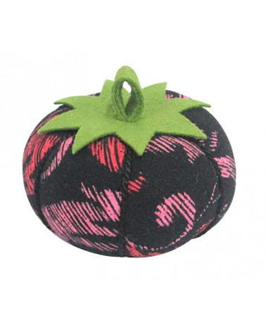 Tomatoes with red and pink arabesque pins on a black background