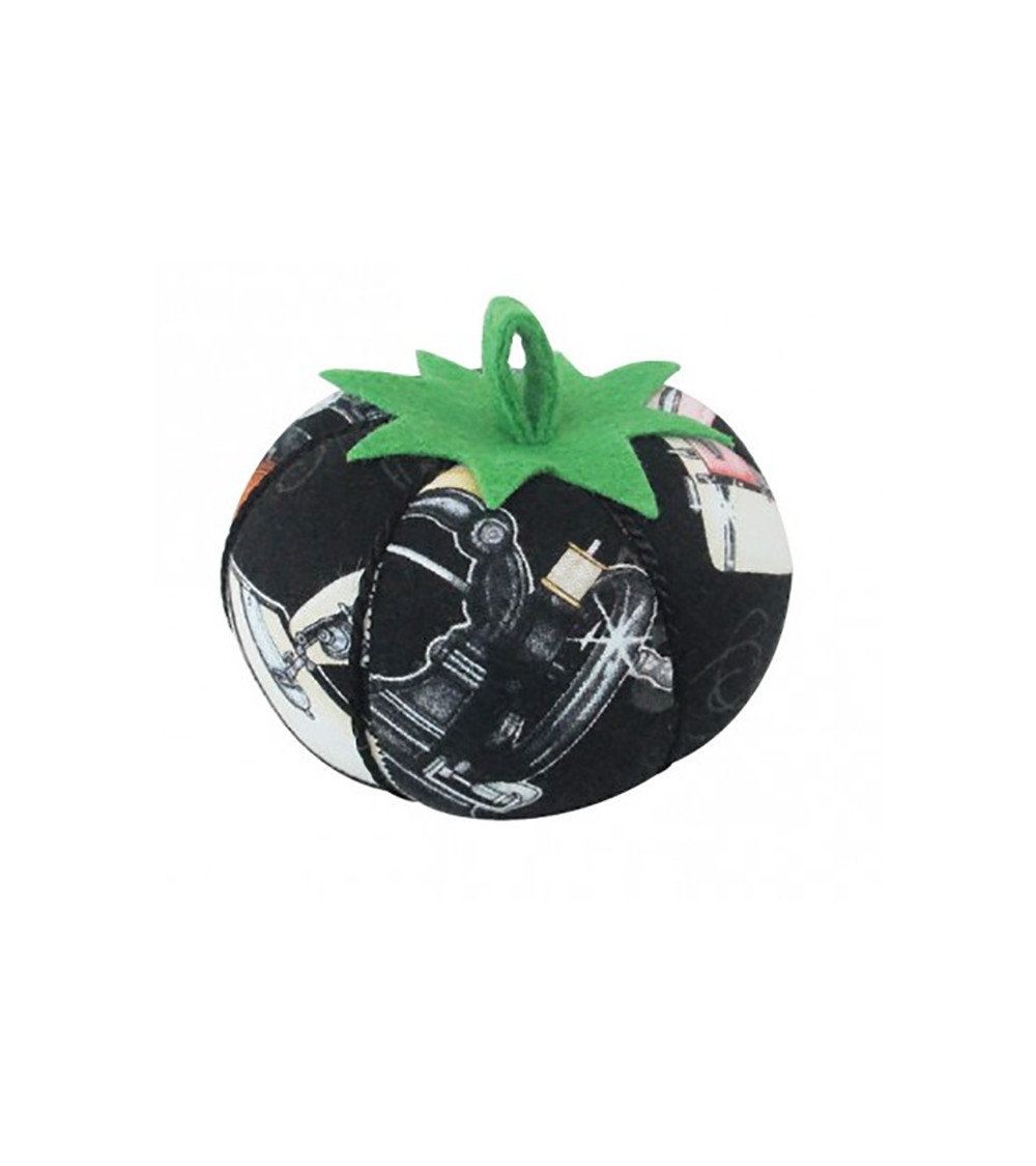 Pin holder tomatoes sewing machine black background