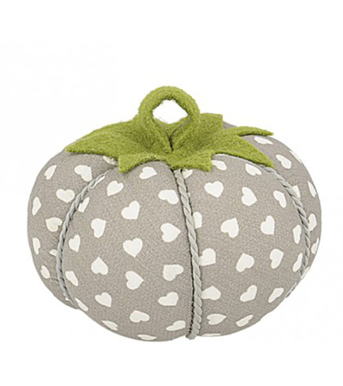 Tomatoes pins white hearts on beige background