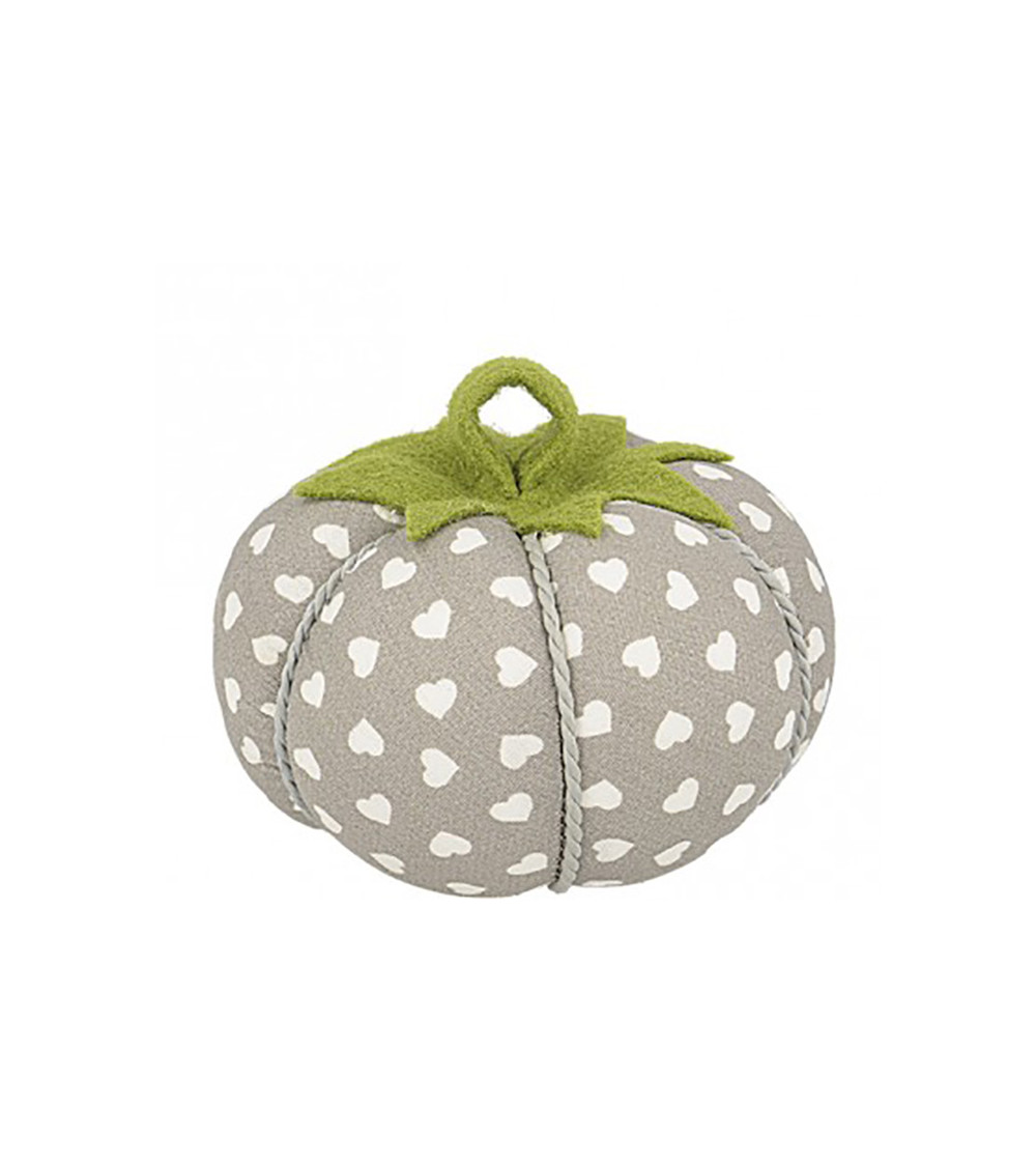 Tomatoes pins white hearts on beige background