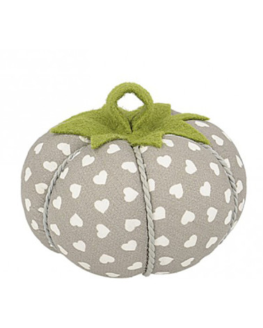 Tomatoes pins white hearts on beige background