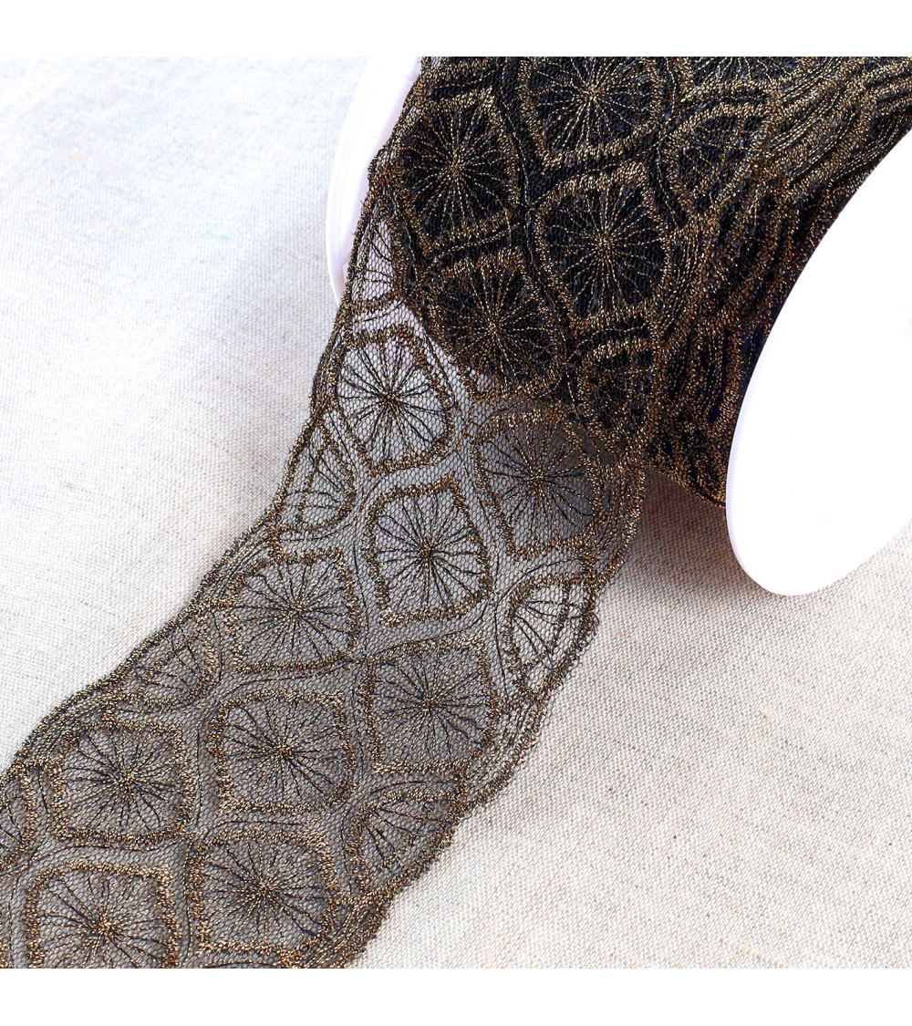 Metallic embroidery on 70mm black/gold tulle per meter