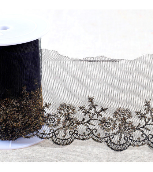 Metallic embroidery on 90mm black/gold tulle per meter
