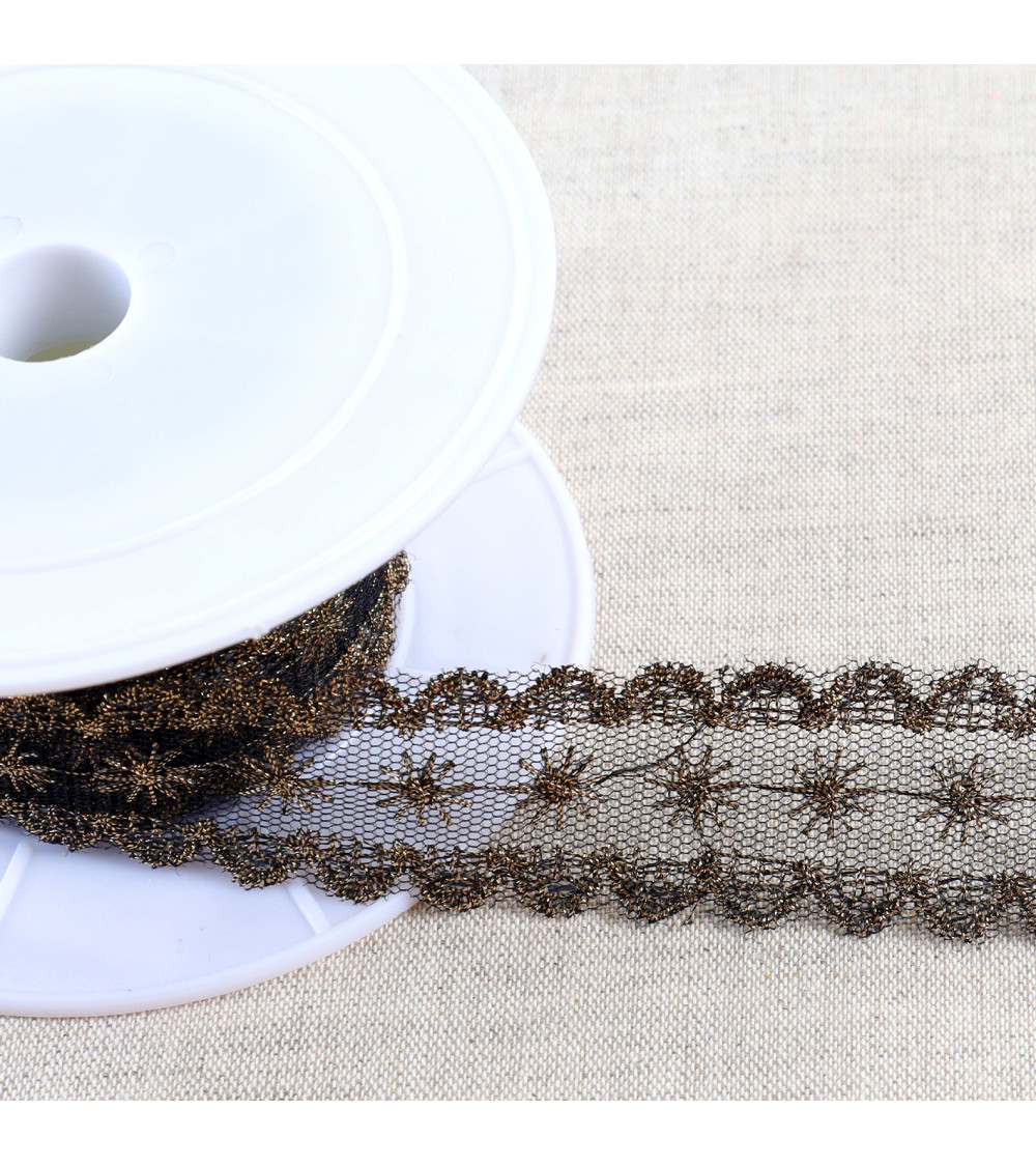Metallic embroidery on 28mm black/gold tulle per meter