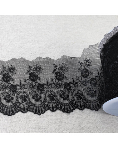 Tulle brodé fleurs festonnées brillant 110mm noir au mètre