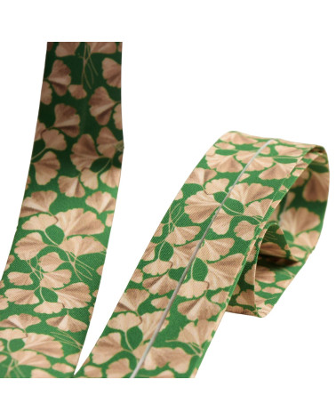 Spool of 25m bias binding with gingko biloba leaves 27mm dark green made in France