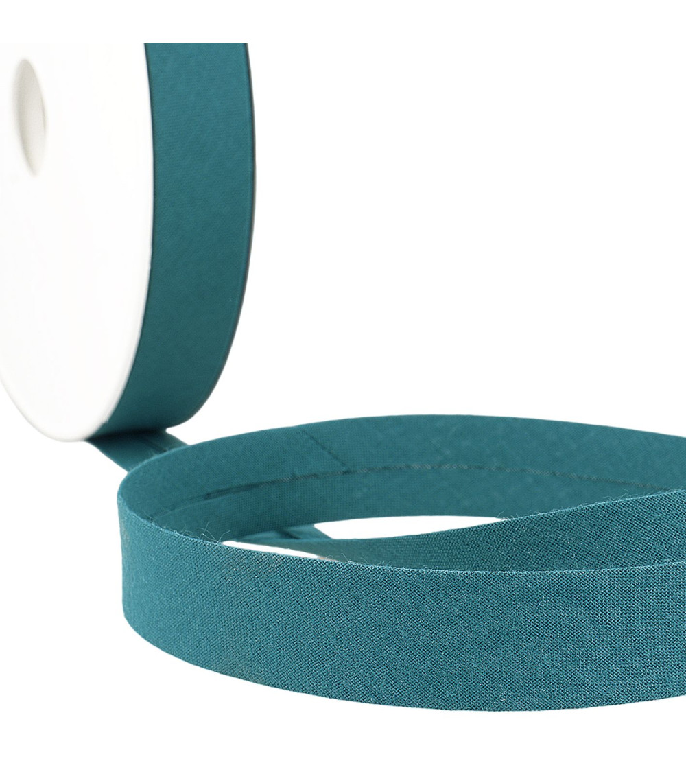 Folded bias all teal blue fabric by the meter made in France