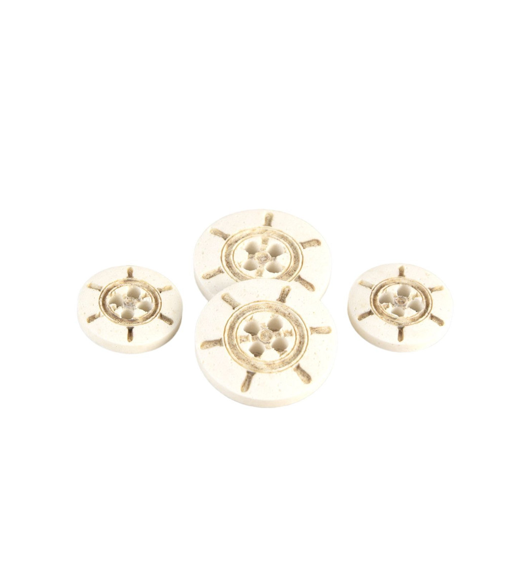 Ivory colored plastic rudder button