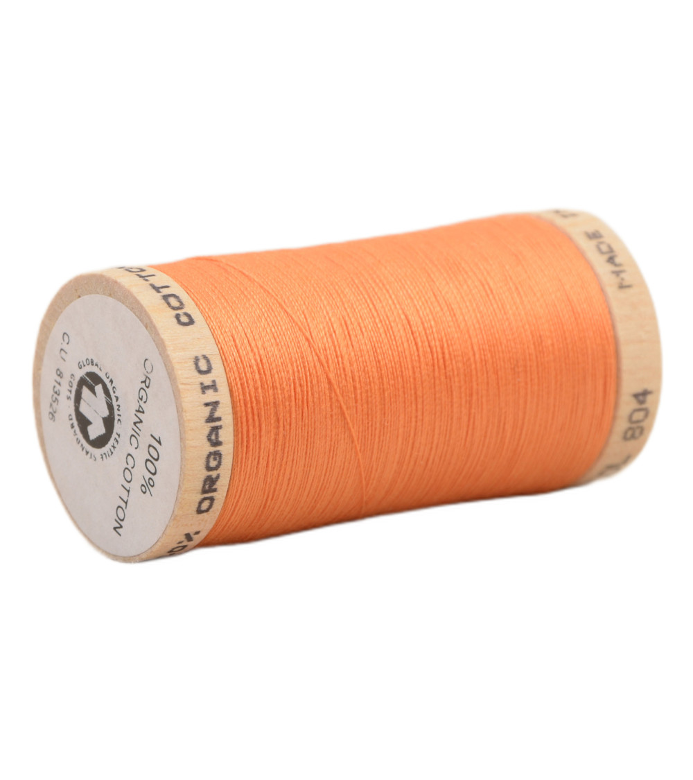 Spool of 100% organic cotton thread 275m orange