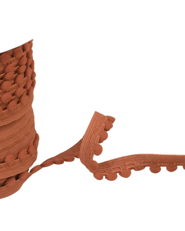 25m spool of elastic with rust orange pompoms 13mm