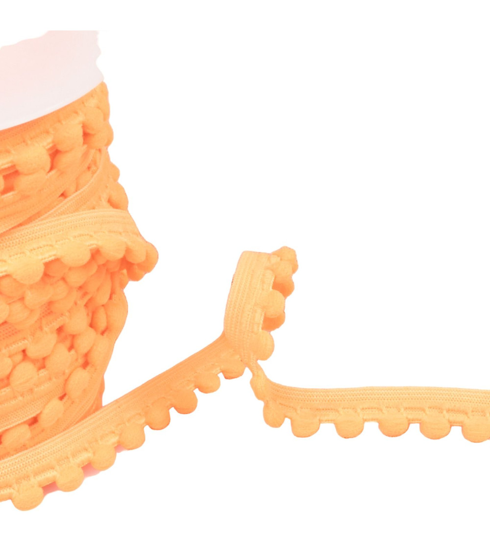 25m spool of elastic with 13mm fluorescent orange pompoms