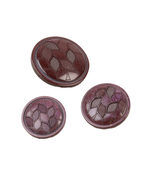 Round button with dark burgundy red leaf shank