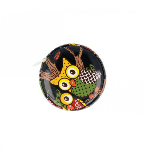 Yellow owl measuring tape on black background