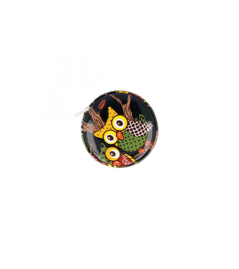 Yellow owl tape measure on black background