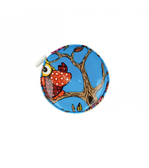 Orange owl measuring tape on blue background