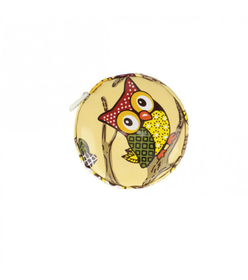 Pink owl measuring tape on beige background