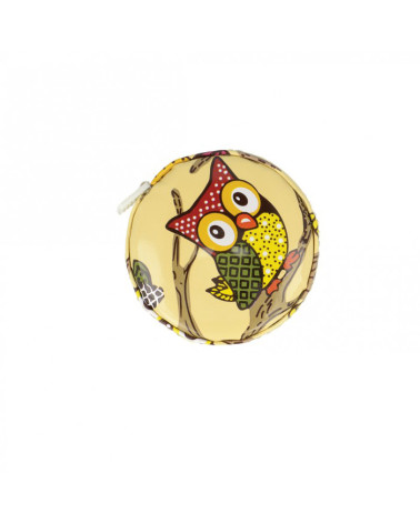 Pink owl tape measure on beige background