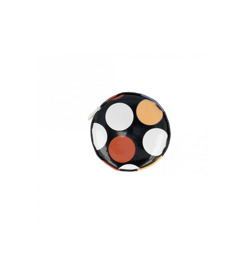 Tape measure with polka dots on black background