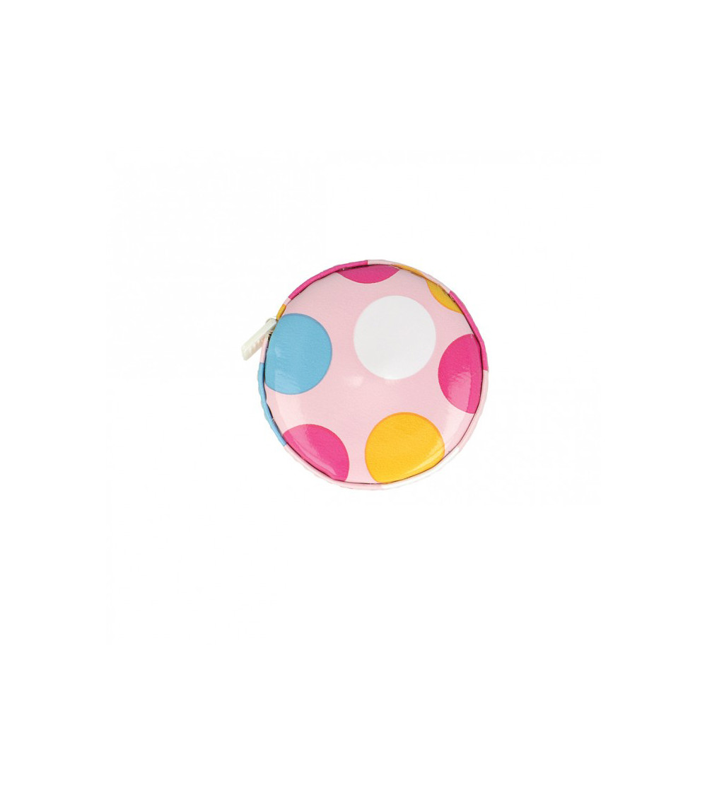 Polka dot tape measure on pink background