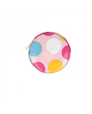 Polka dot tape measure on pink background