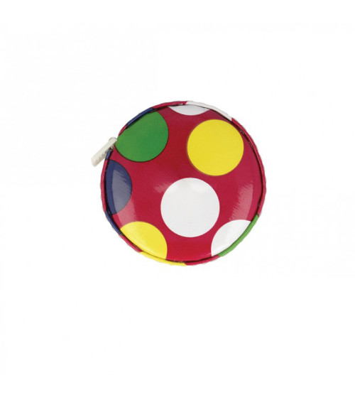 Polka dot tape measure on red background