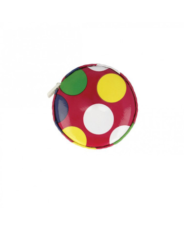 Tape measure with polka dots on a red background