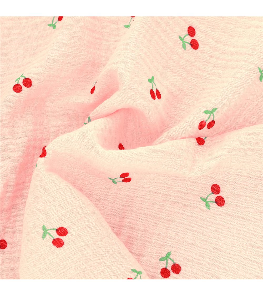 Tissu double gaze imprimée cerise fond rose au mètre