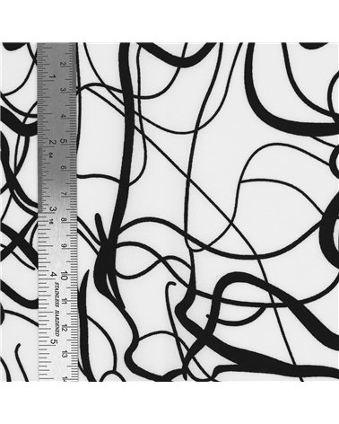 Tessuto elasticizzato morbidissimo stampato con arabeschi bianchi e neri 150 cm al metro