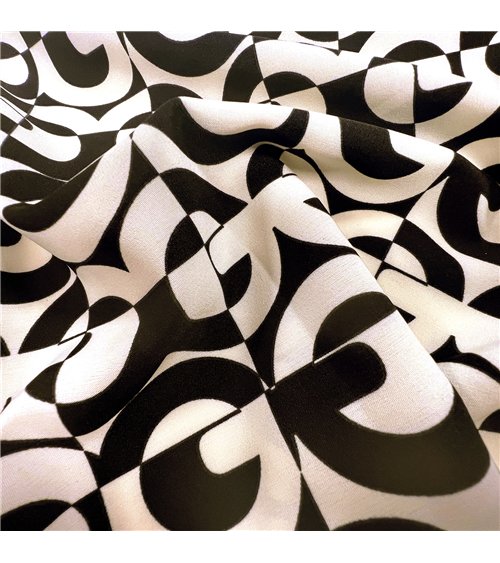 Super soft stretch fabric printed with black circles 150cm per meter