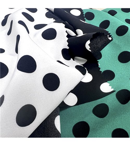 Tessuto elasticizzato super morbido stampato con pois neri su fondo bianco 150 cm al metro