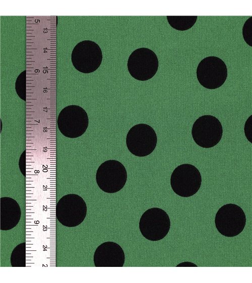 Tela elástica súper suave estampada de lunares negros sobre fondo verde 150 cm por metro