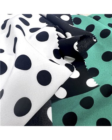 Super soft stretch fabric printed with white polka dots on black background 150cm per meter