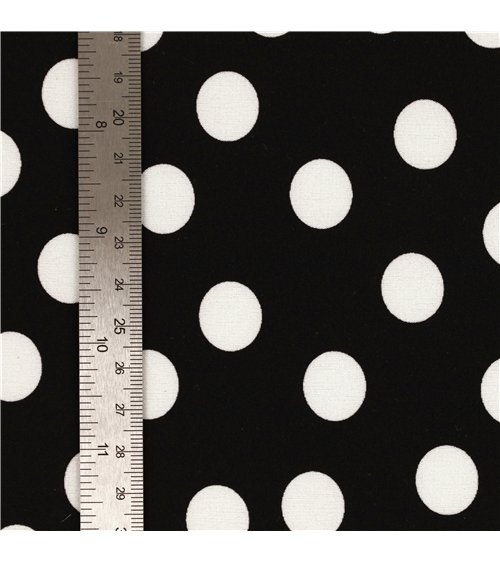 Super soft stretch fabric printed with white polka dots on black background 150cm per meter