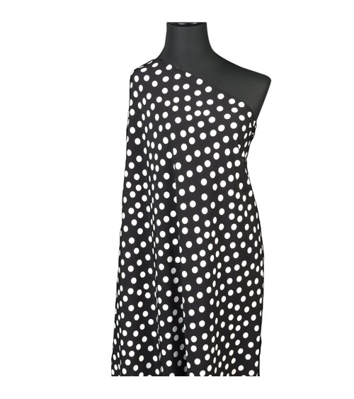 Tela elástica súper suave estampada con lunares blancos sobre fondo negro 150 cm por metro