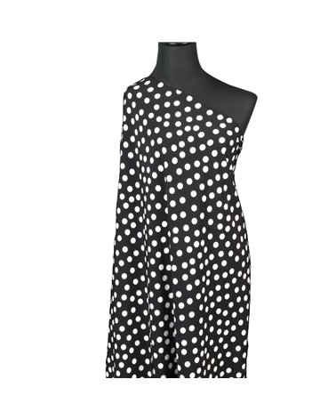 Super soft stretch fabric printed with white polka dots on black background 150cm per meter